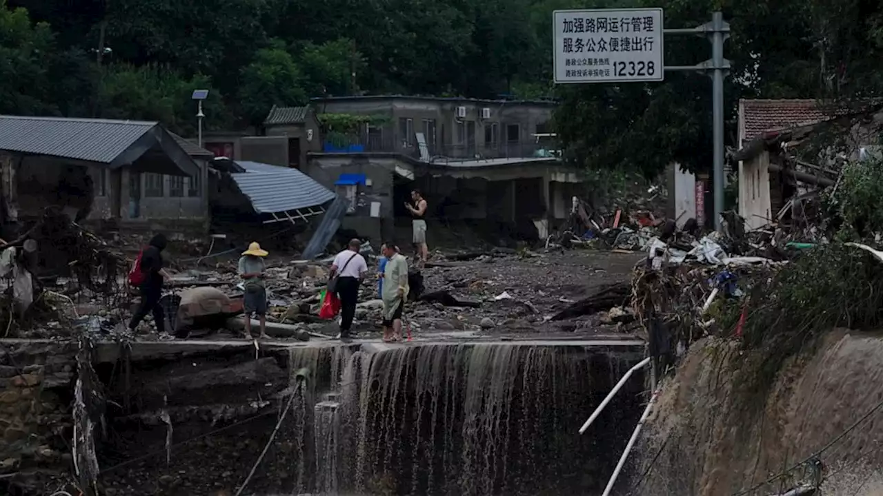 11 dead and 27 missing in flooding around Beijing after days of rain, Chinese state media report