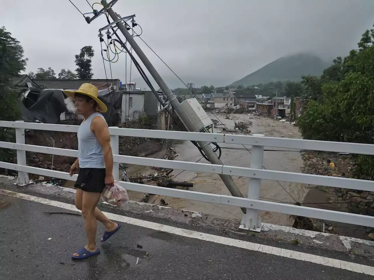 At least 20 dead and 27 missing in floods surrounding China's capital Beijing, thousands evacuated