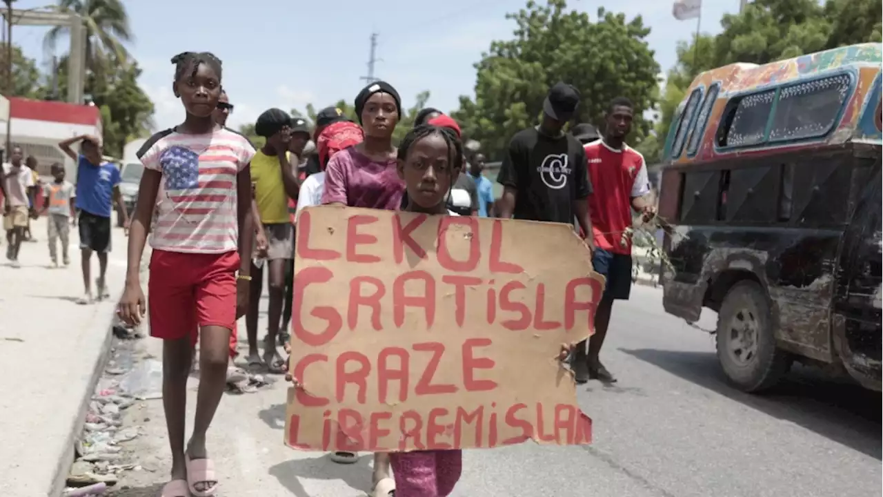 Haitians, weary of gang violence, protest the kidnapping of an American nurse and her daughter