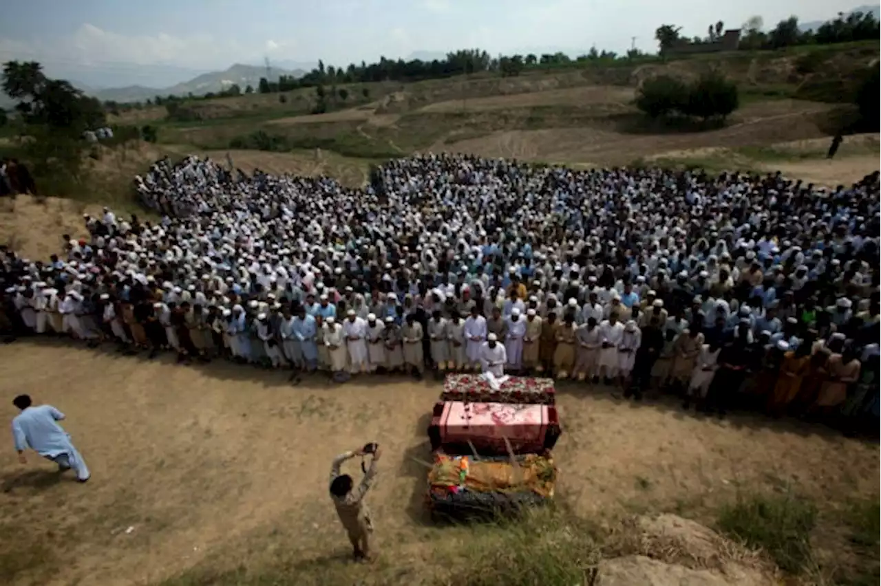 IS claims responsibility for bombing that killed 54 at pro-Taliban election rally in Pakistan