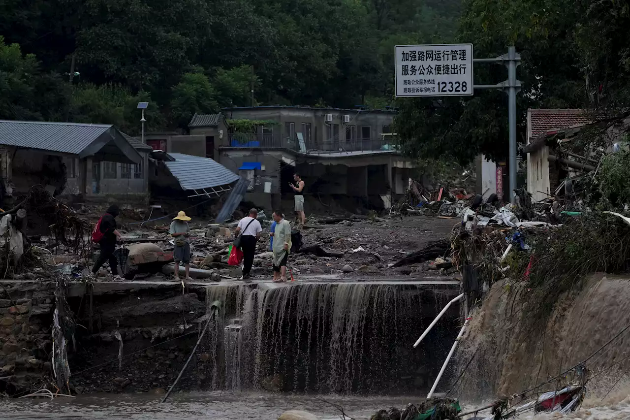 At least 11 dead and 27 missing in flooding around Beijing after days of rain, Chinese state media report