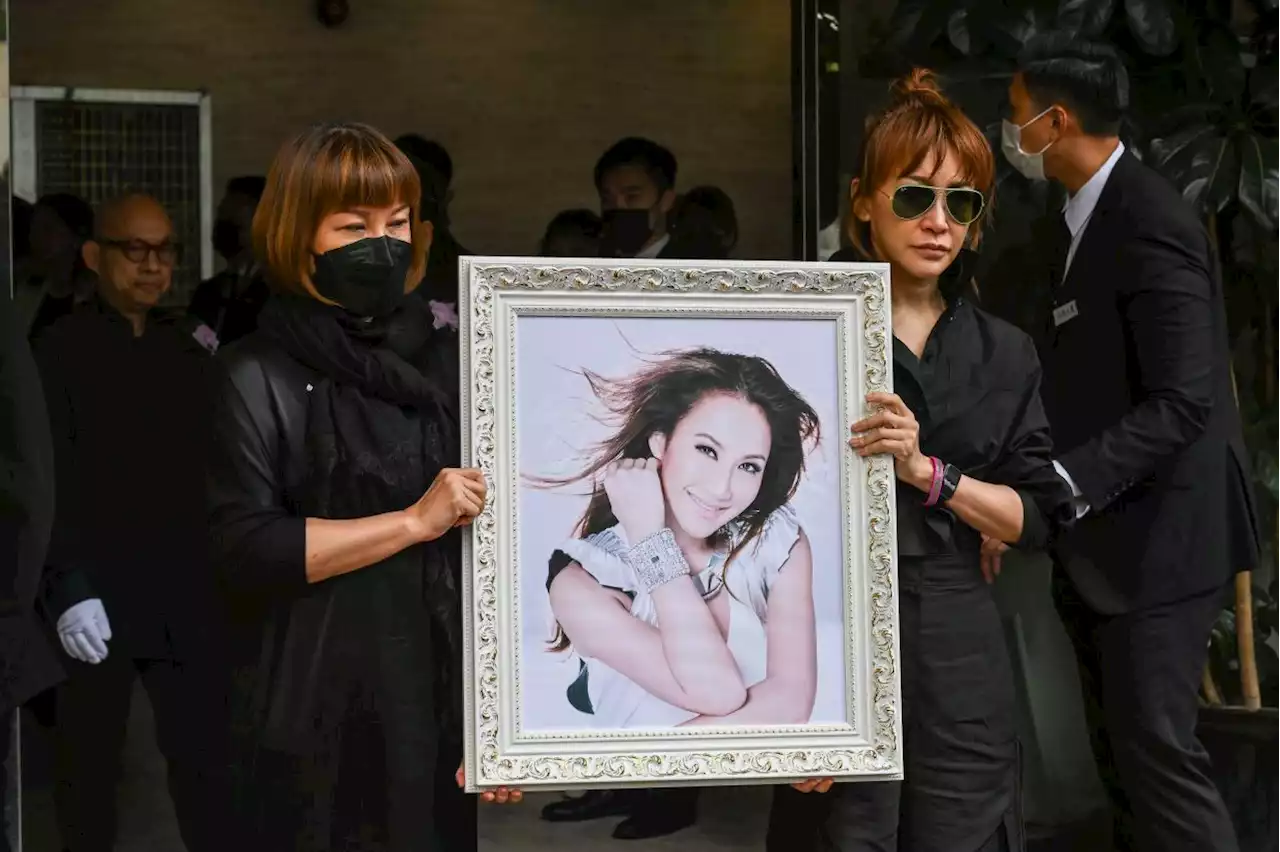 Late singer Coco Lee's estranged husband says at crematorium he loved her