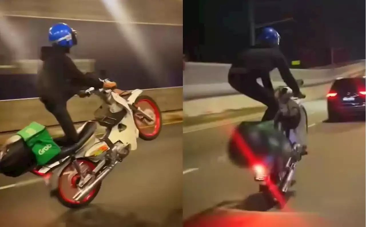 (Video) Grab Delivery Rider Performs Dangerous Wheelie Stunt In KL - Hype MY