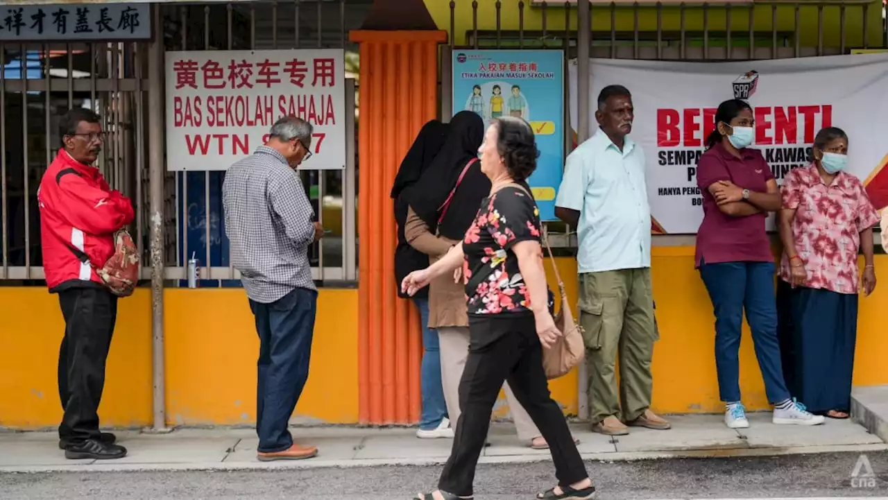 Hopes, frustration, and resolve on display as voting kicks off to a slow start in Malaysian state polls