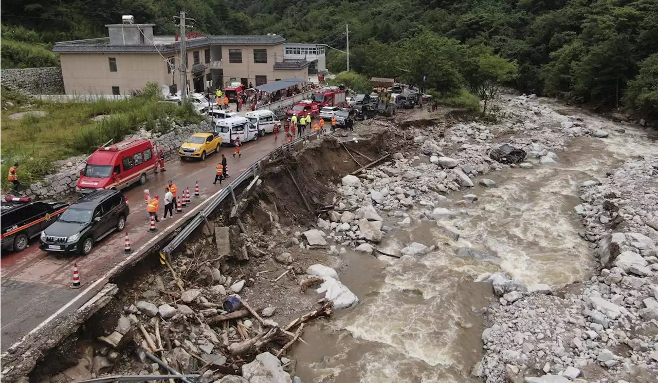 China evacuates residents and searches for mudslide victims as storms lash parts of the country