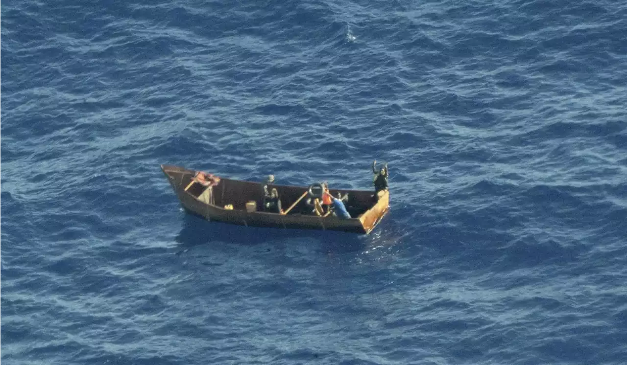 Migrants from dozens of boats reach tiny Italian isles; charity ship rescues hundreds of people