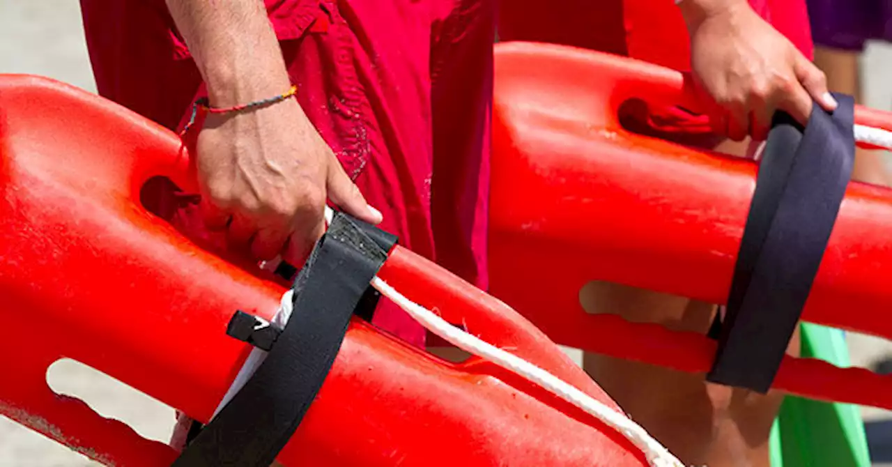 WATCH - 'Awesome': Lifeguards Form Human Chain to Rescue Swimmer