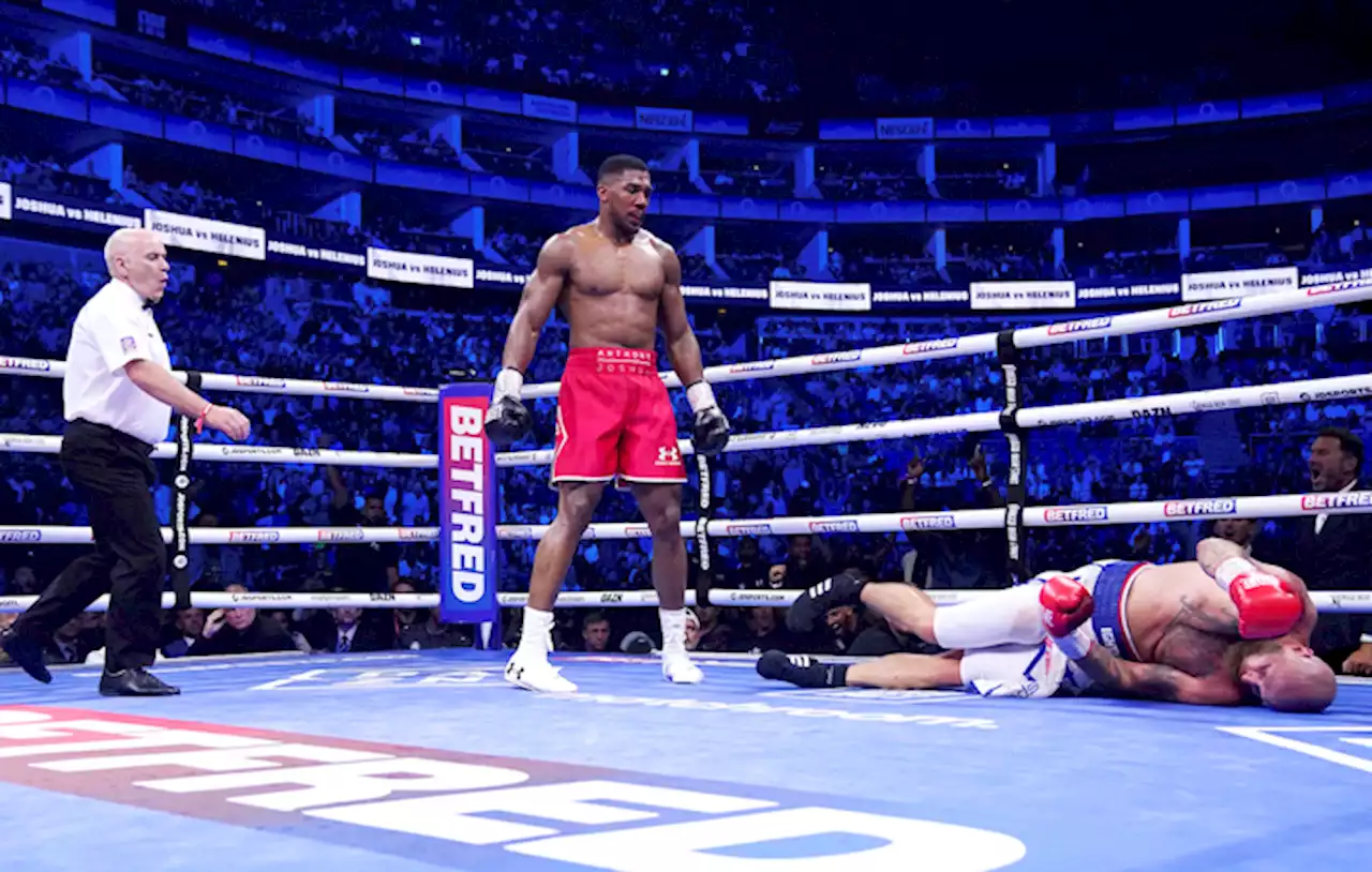 Joshua knocks out Helenius in 7th round after earlier jeers from fans | The Associated Press