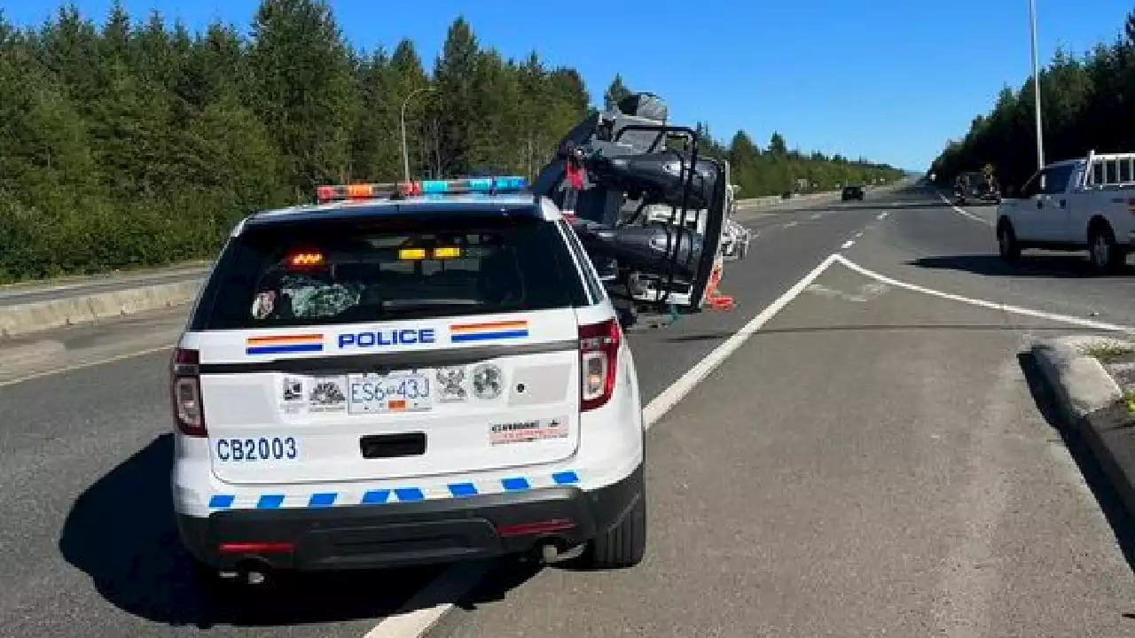 Boat on road blocking one highway lane near Campbell River Airport