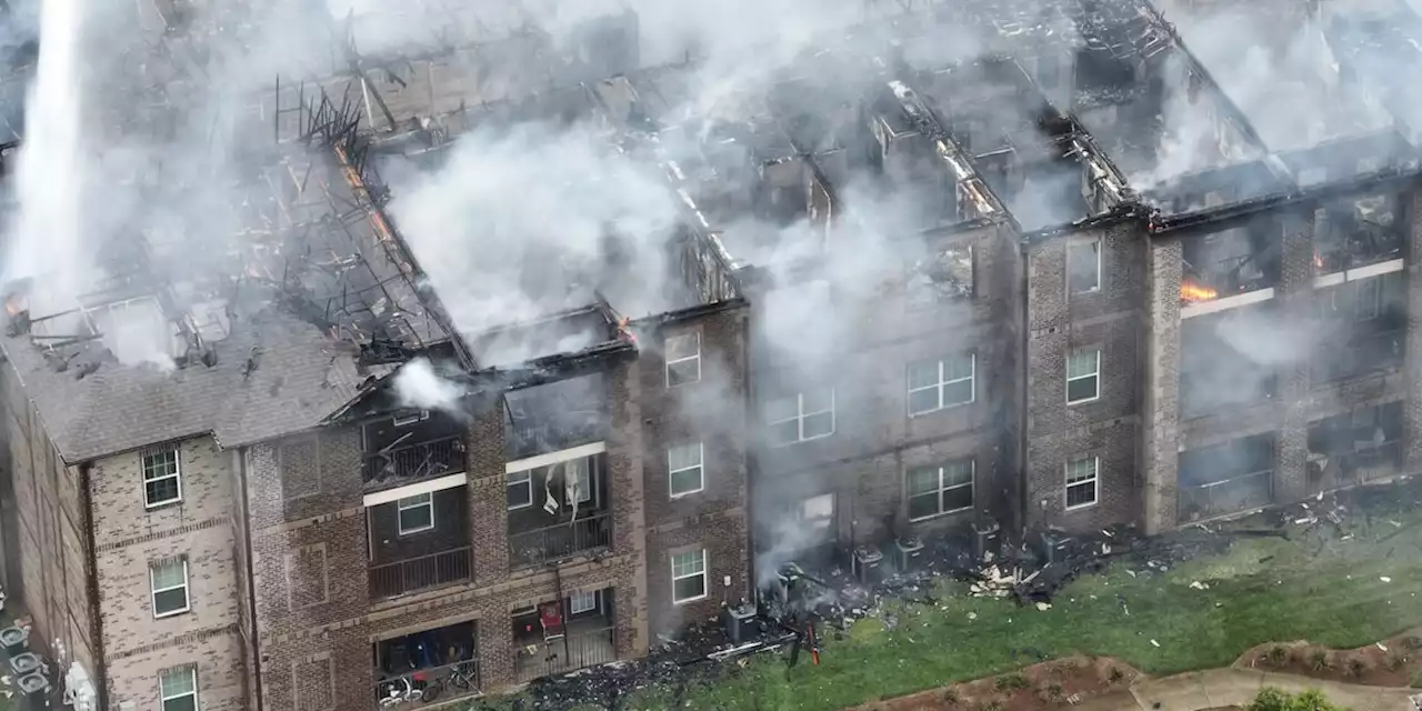 Apartment building struck by lightning catches fire, collapses