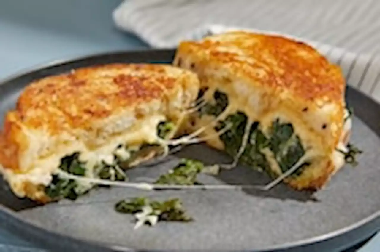 Leafy greens go decadent in this gloriously messy grilled cheese