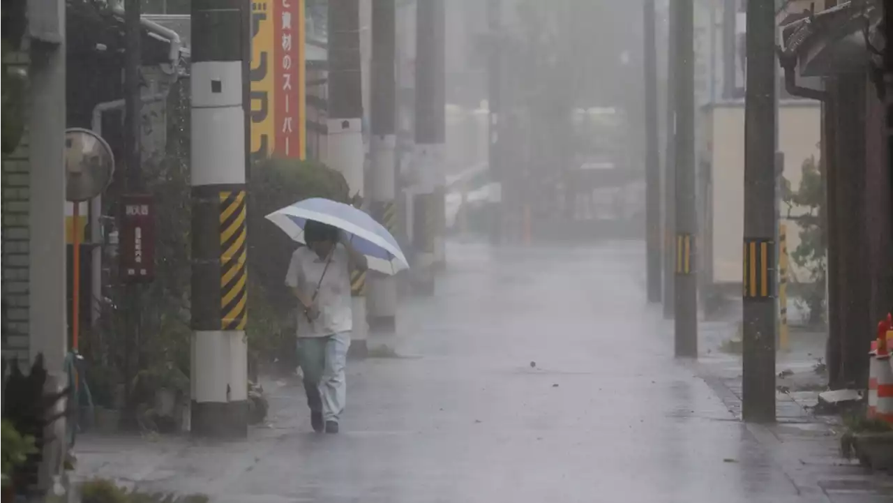 A strong tropical storm is lashing parts of Japan and disrupting holiday travel