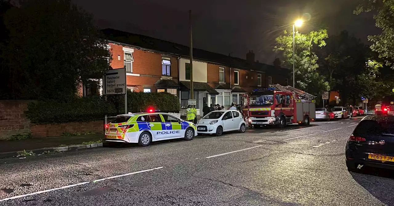 House taped off with 'smashed windows' after 'explosion' in Bury