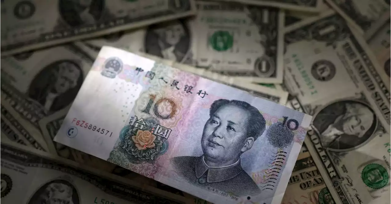 Dollar firm, yuan slides after China unexpectedly cuts rates