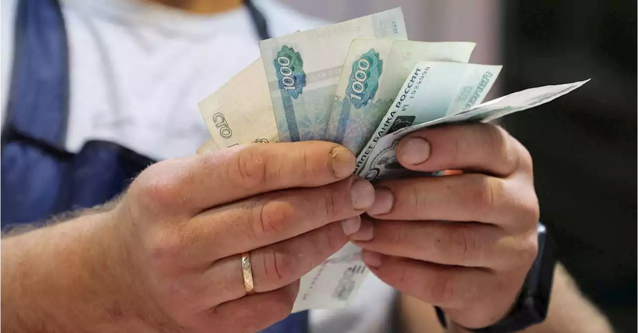 Russian central bank jacks up rates to 12% to support battered rouble