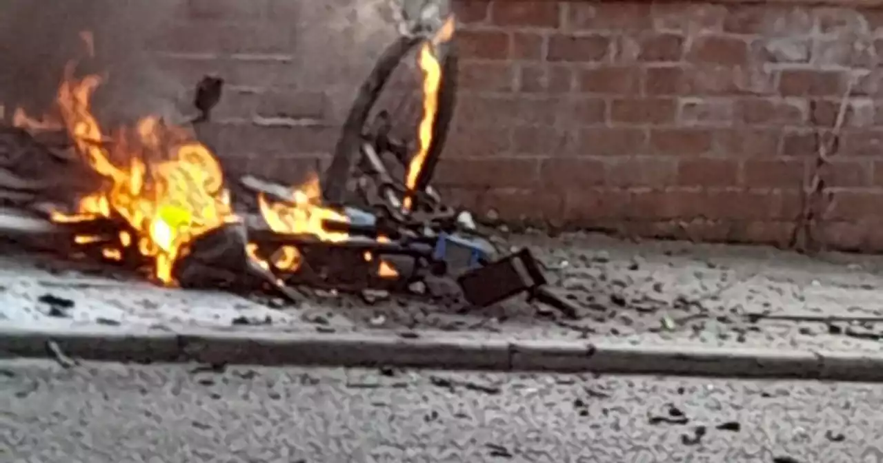 Electric bike bursts into flames outside house as fire crews close off road