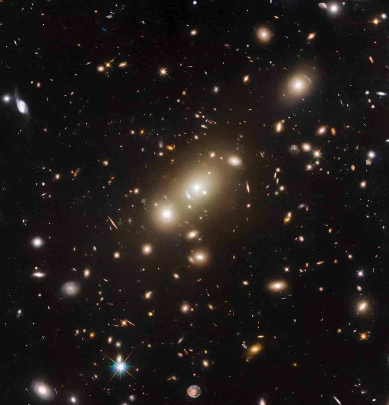 Cosmic Leviathan Unveiled: Hubble Space Telescope Captures Truly Massive Galaxy Cluster