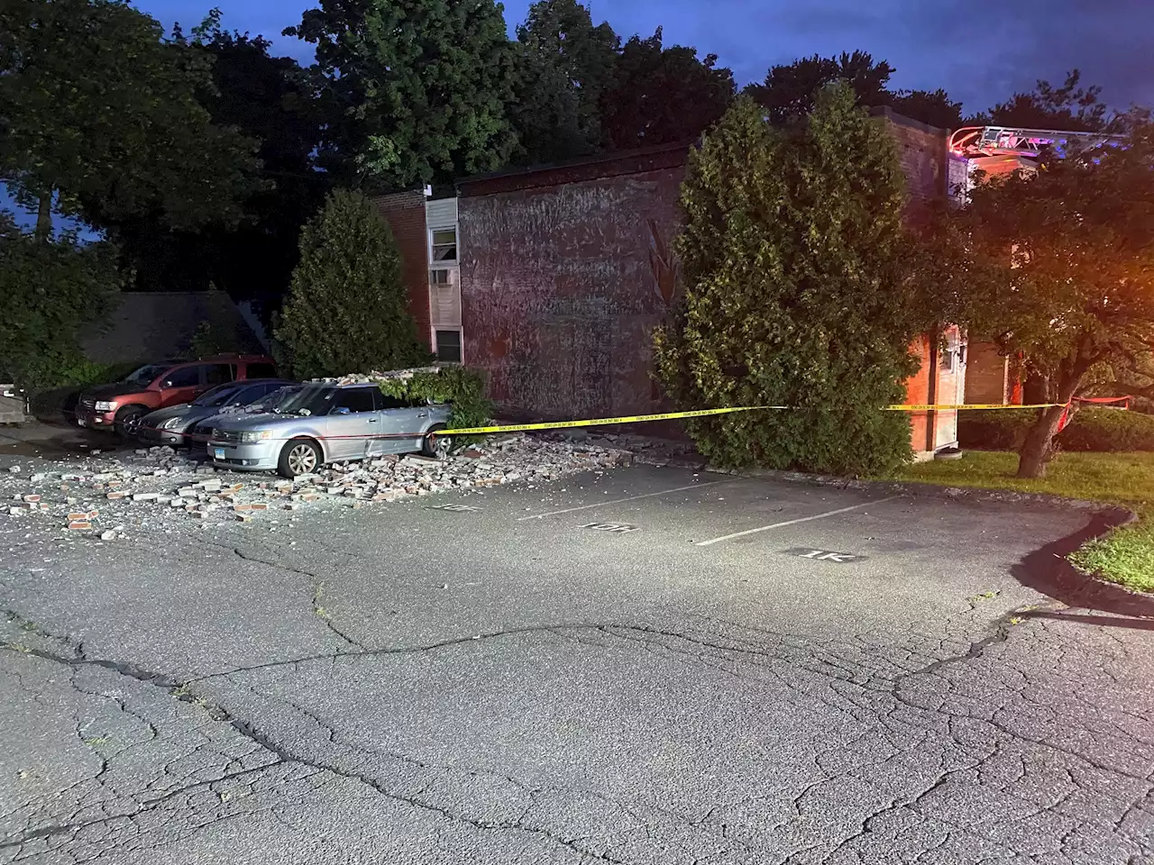 Building collapse damages cars, sends firefighter to the hospital in Manchester Conn.