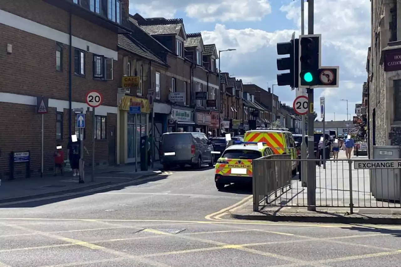 Police close town centre road as ambulances called