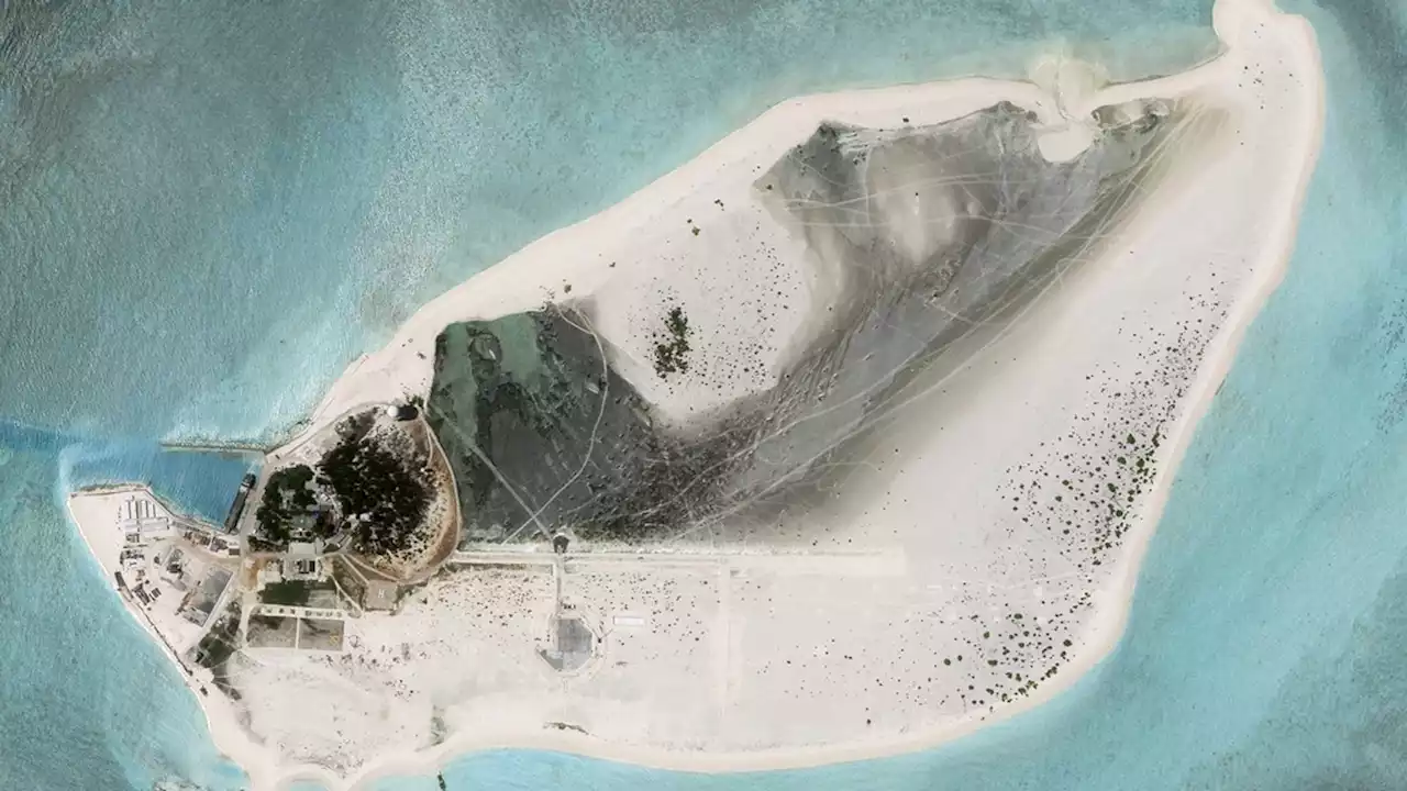 China building airstrip on disputed island in South China Sea, satellite images suggest