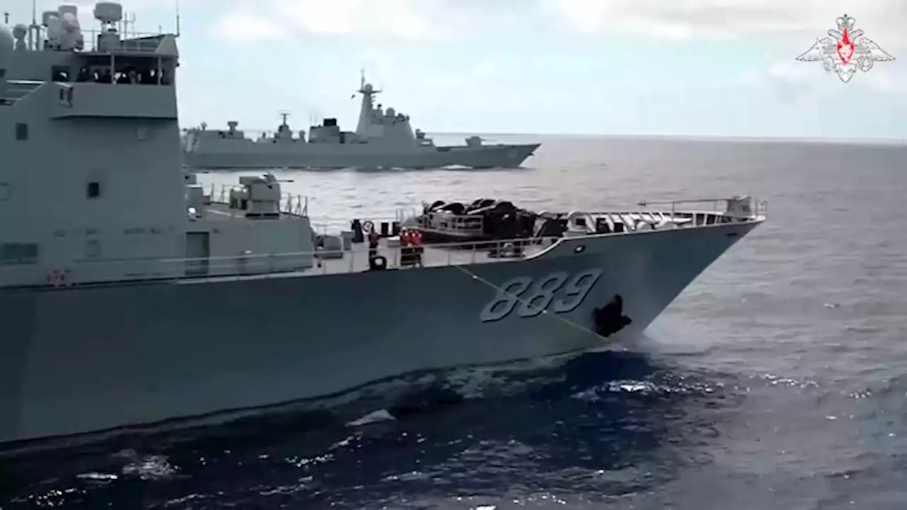 Russian and Chinese warships sail close to Japanese islands on eve of Biden's trilateral summit