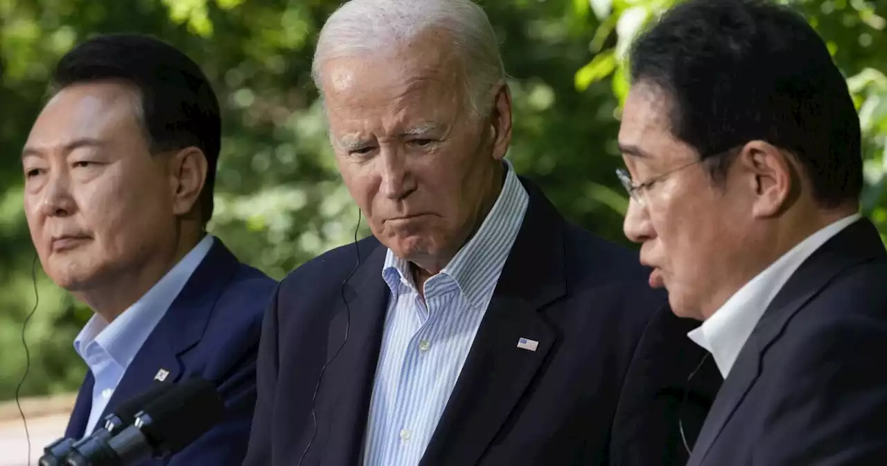 Biden chides Trump's 'America First' foreign policy at Camp David trilateral