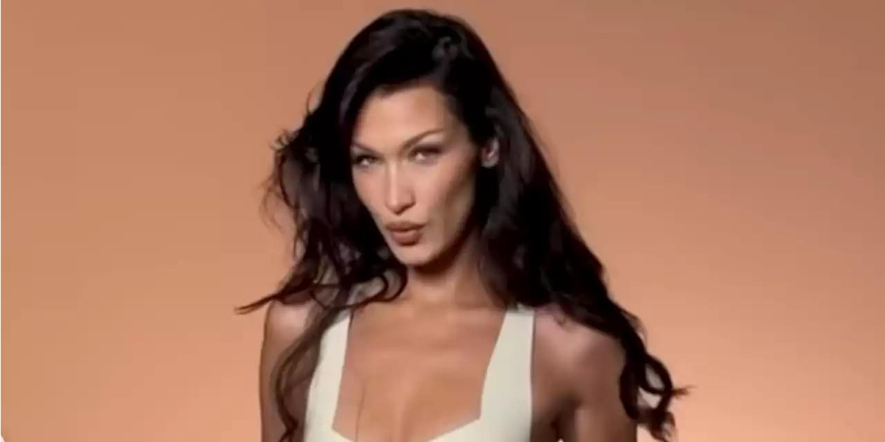 Bella Hadid Dances on Set in a Skintight White Latex Midi Dress