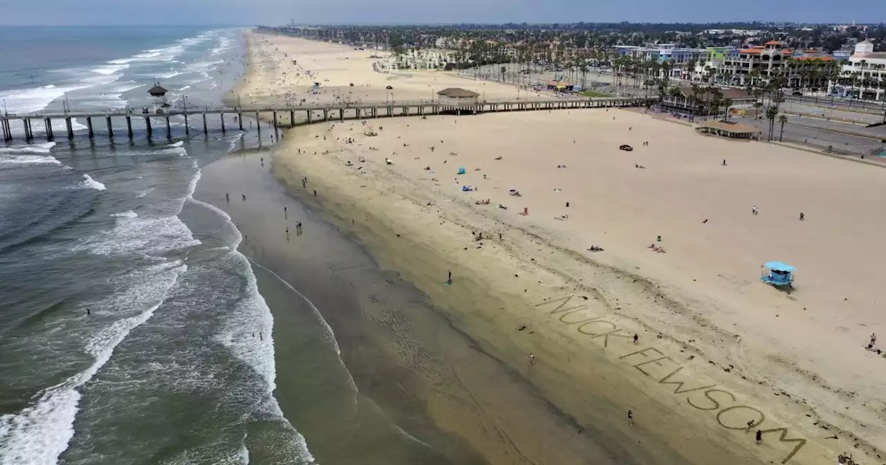 Huntington Beach officials clear waters and beach due to oil-like 'sheen'