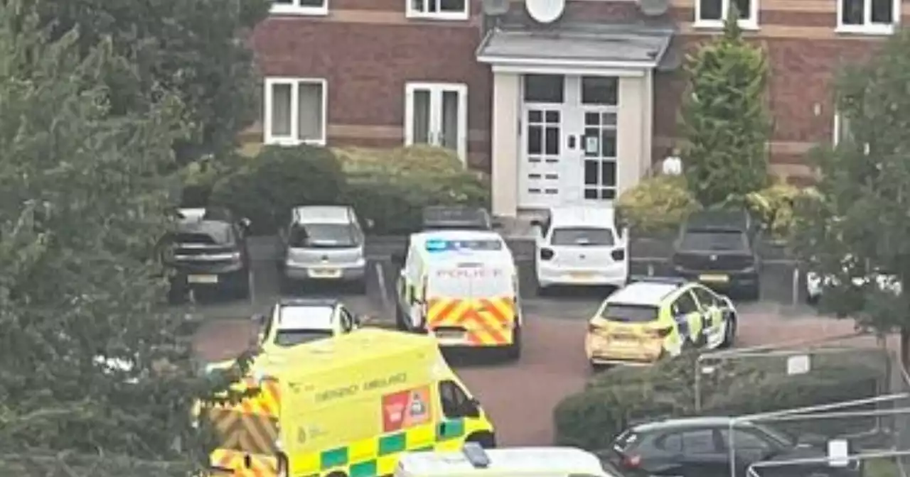 LIVE updates as huge police presence on street and air ambulance lands