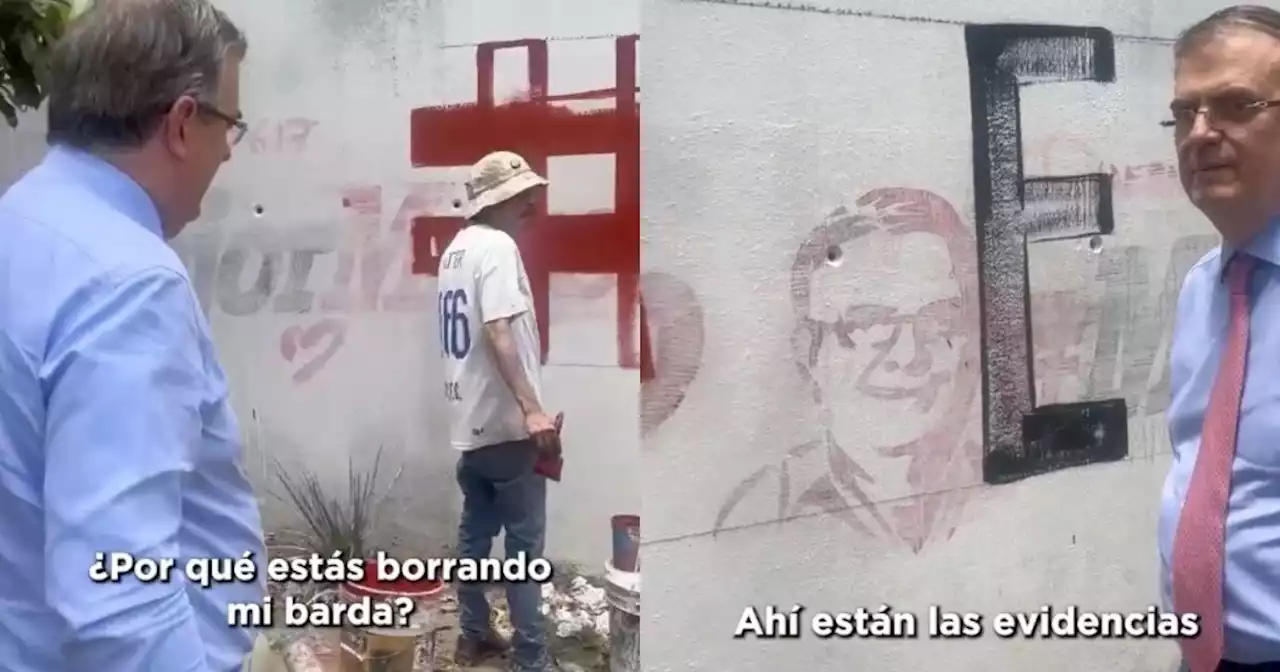 Video: “¿Por qué estás borrando mi barda?”, cuestiona Ebrard a pintor en la CDMX