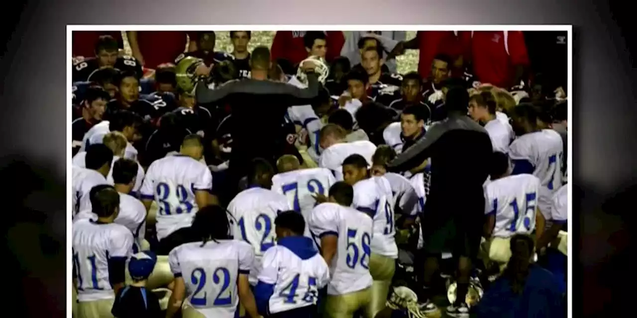 School reinstates football coach who lost his job after praying on field