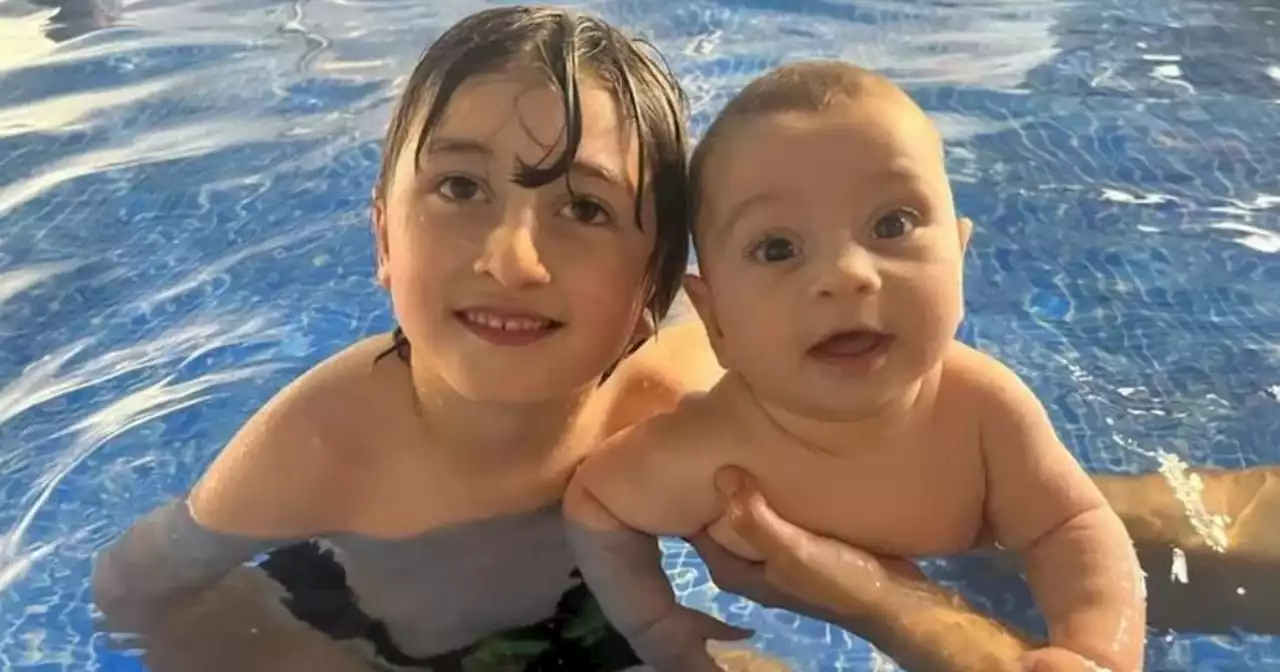 Haunting image shows boy playing with brother before dying in swimming pool