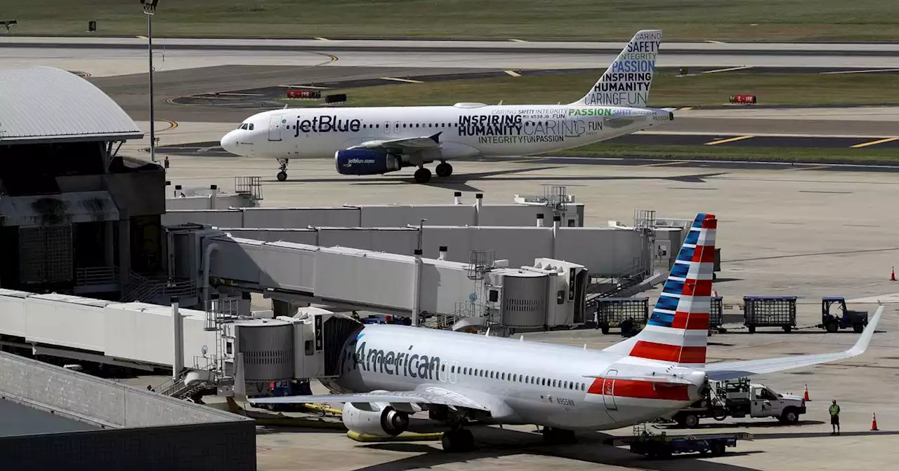 JetBlue warns of a possible loss as it ends a deal with American Airlines