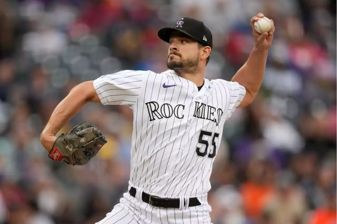 Rockies trade left-handed pitcher Brad Hand to Braves for prospect Alec Barger