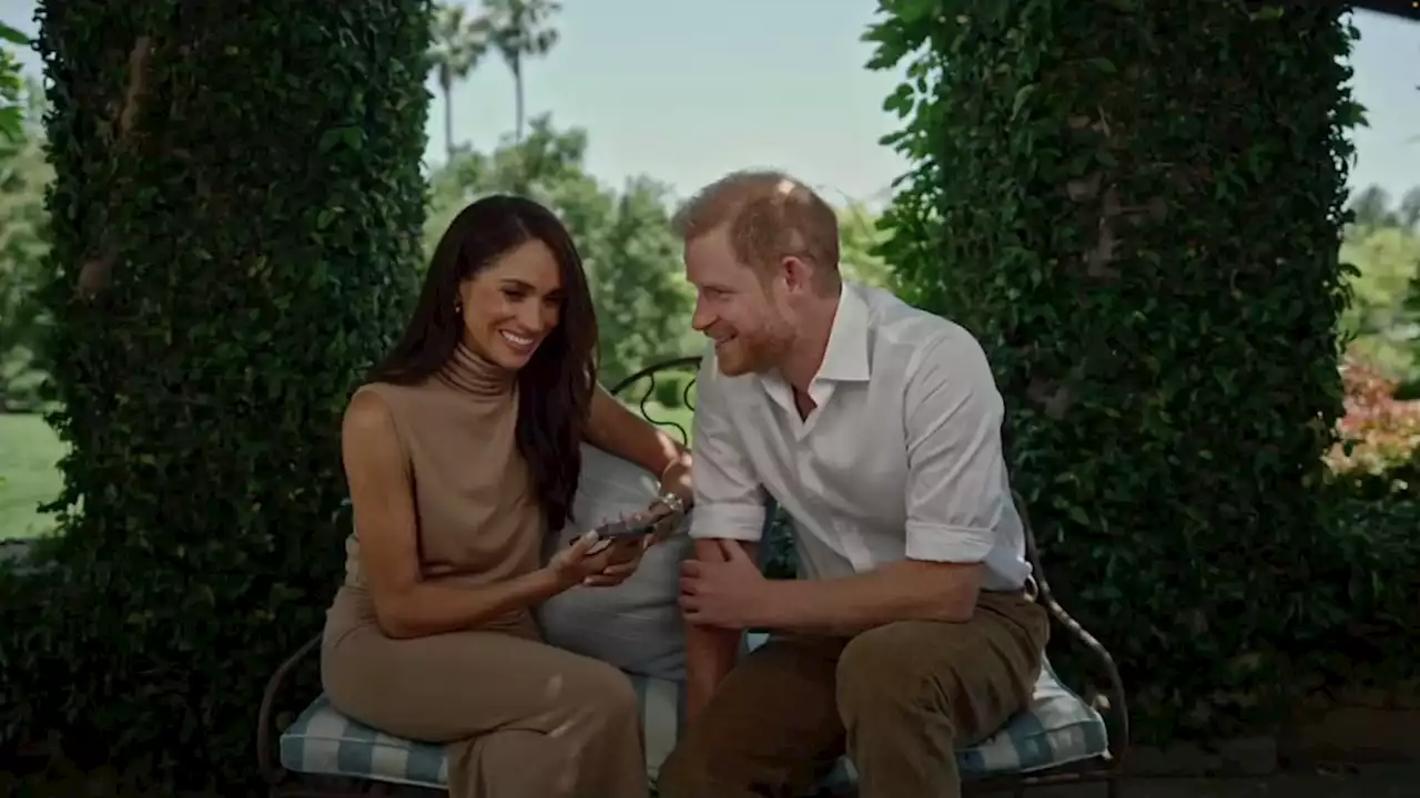 Meghan Markle and Prince Harry put on tactile display for surprise appearance amid summer break