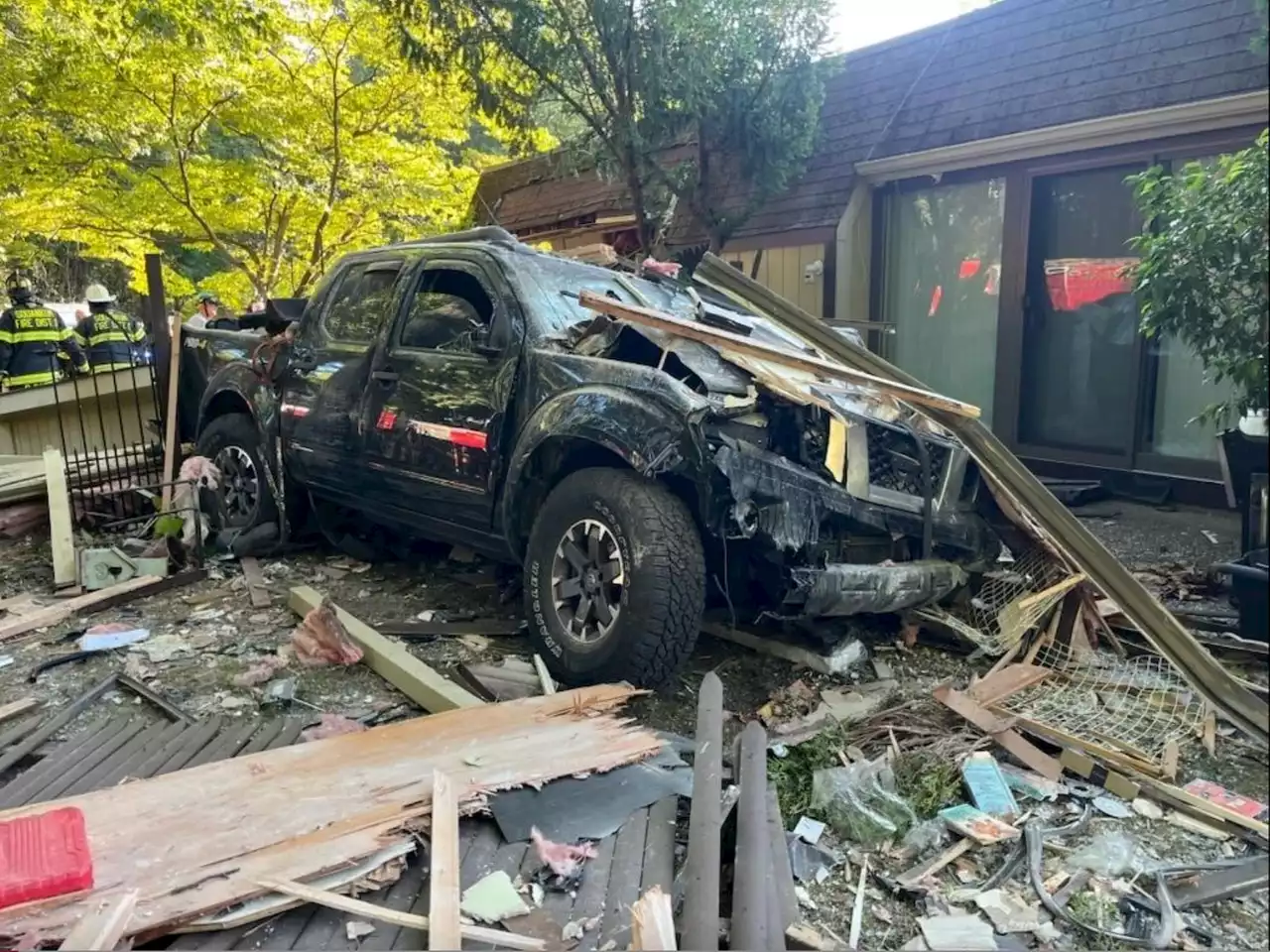 Driver injured after pickup truck slams into home