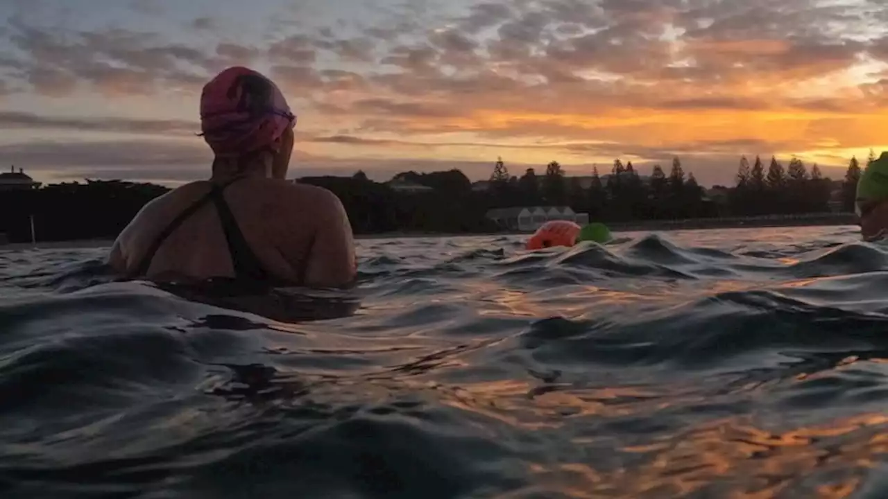 Dad's memory drives daughter's epic swim to help cancer patients find peace