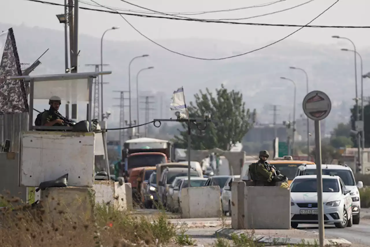 Suspected Palestinian shooting attackat West Bank car wash kills 2 Israelis | Sam Mcneil & Nasser Nasser / The Associated Press