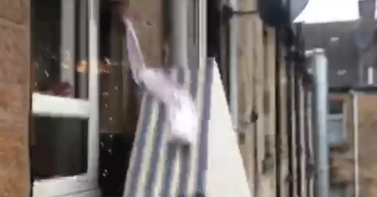 Glasgow resident filmed chucking bed out window of third floor tenement flat