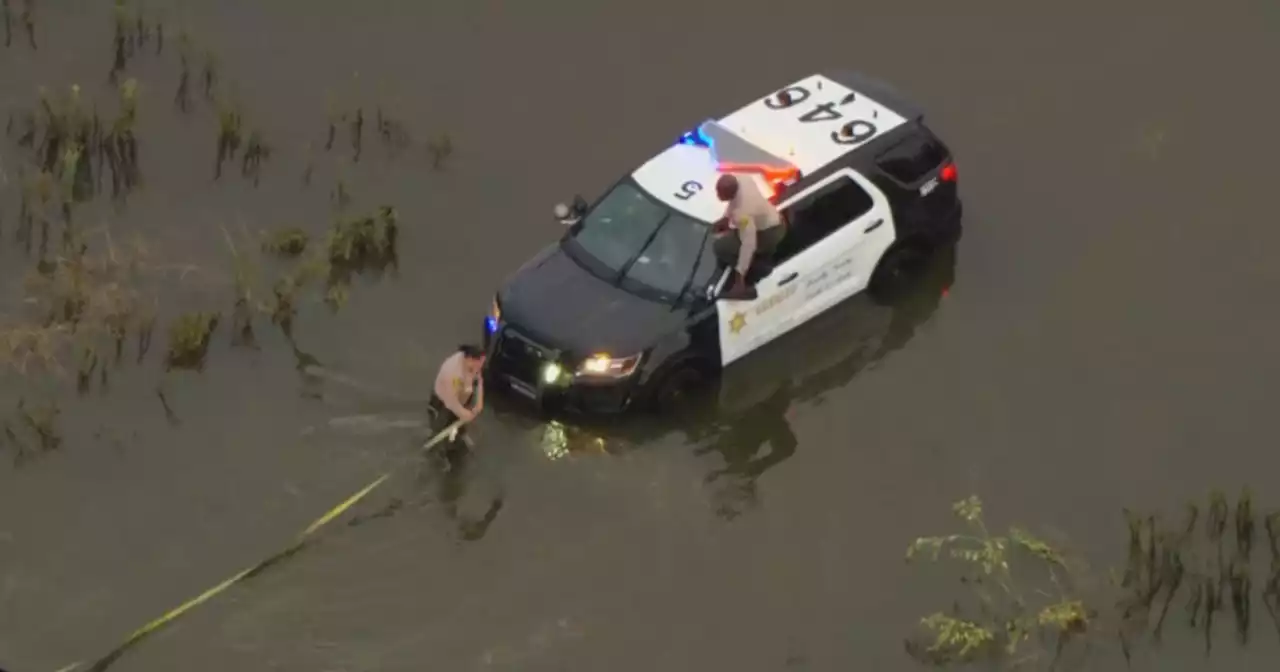 Tropical Storm Hilary: LA sheriff's deputy cruiser pulled from South El Monte flood waters