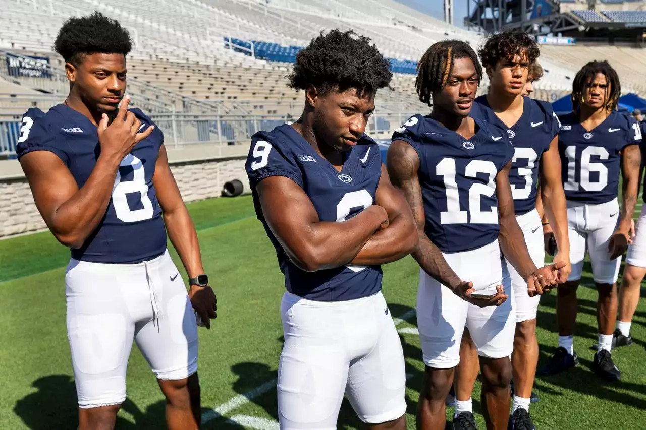 Penn State freshmen in uniform at football picture day; Scenes from the event