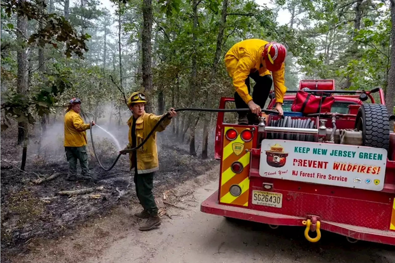 Crews are battling a 100-acre wildfire near the former Atco Dragway