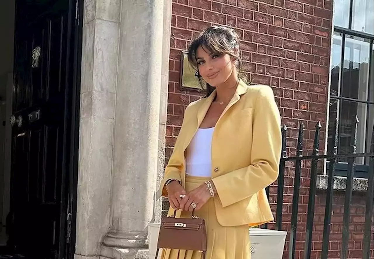 Suzanne Jackson stuns in her mother's suit for baby shower