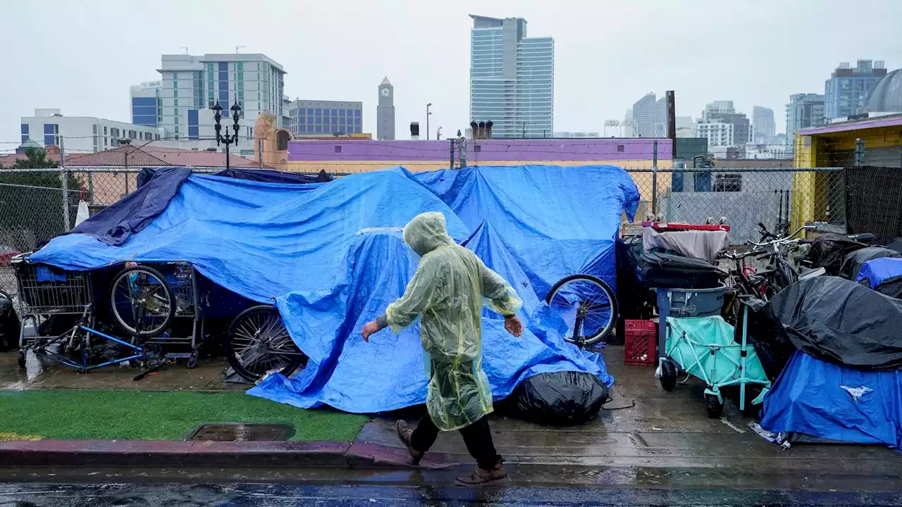 Rains from Tropical Storm Hilary swamp roads, trap cars and flood buildings in California and Mexico