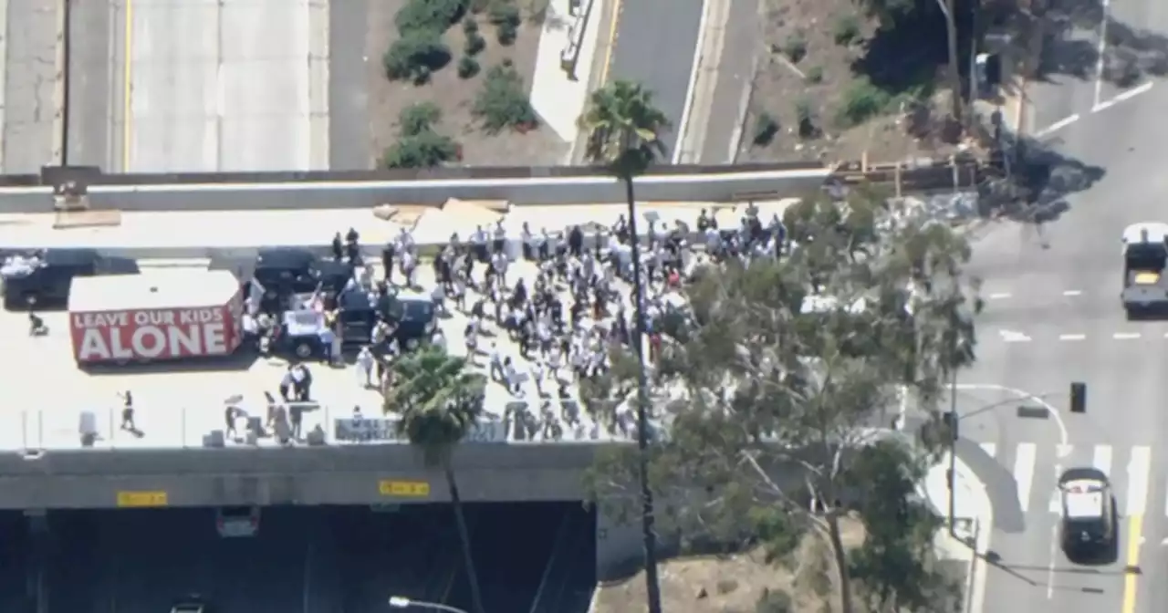 2 people detained as parents-rights and LGBTQ+ groups hold duel rallies downtown Los Angeles