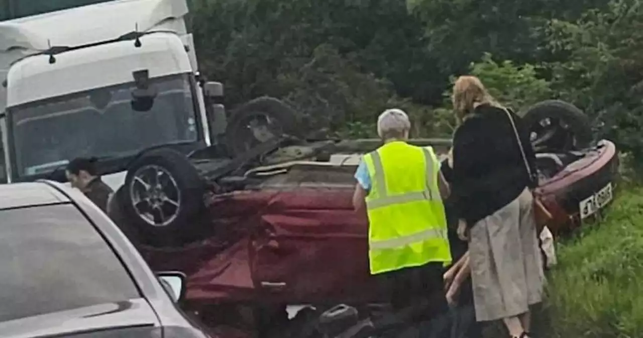 Two people in hospital after car flips onto roof in horror crash in Scots town