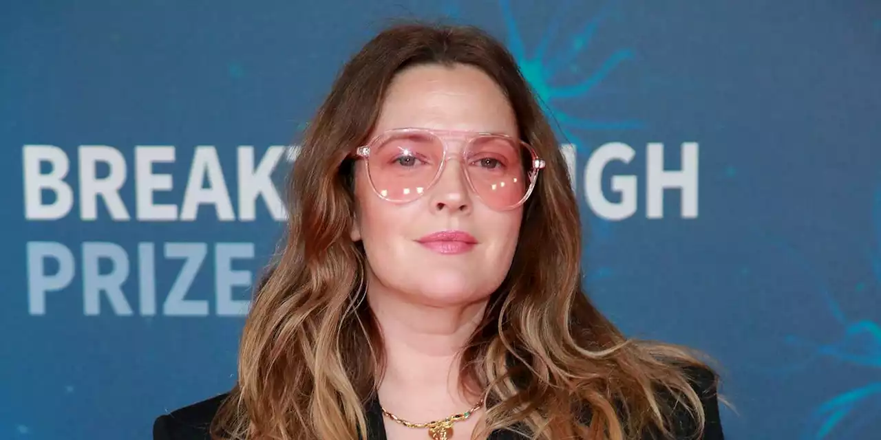 Drew Barrymore escorted away after man approaches stage during interview