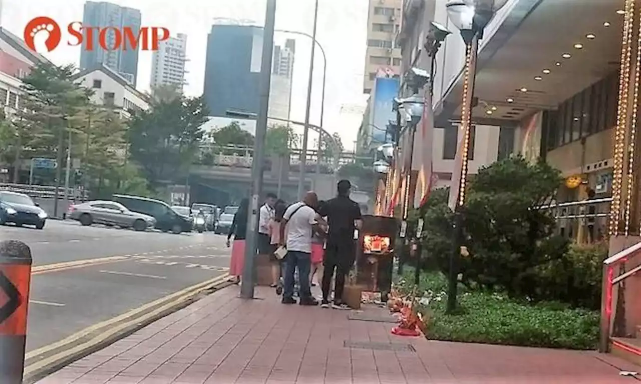 Workers 'ignore public safety', burn offerings near bus stop in front of People's Park Centre