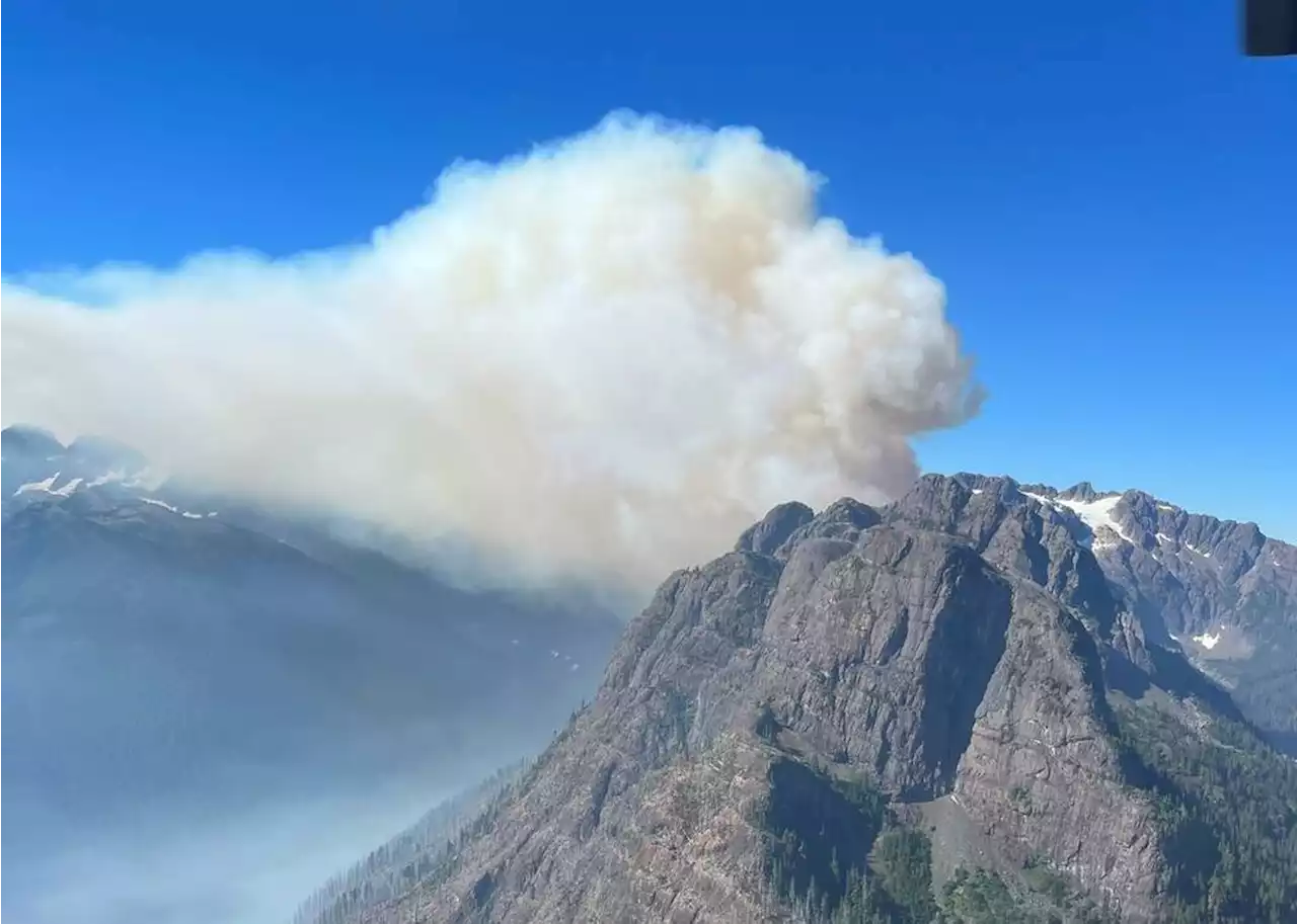 Large mountain wildfire not being fought due to location; local smoky air eases