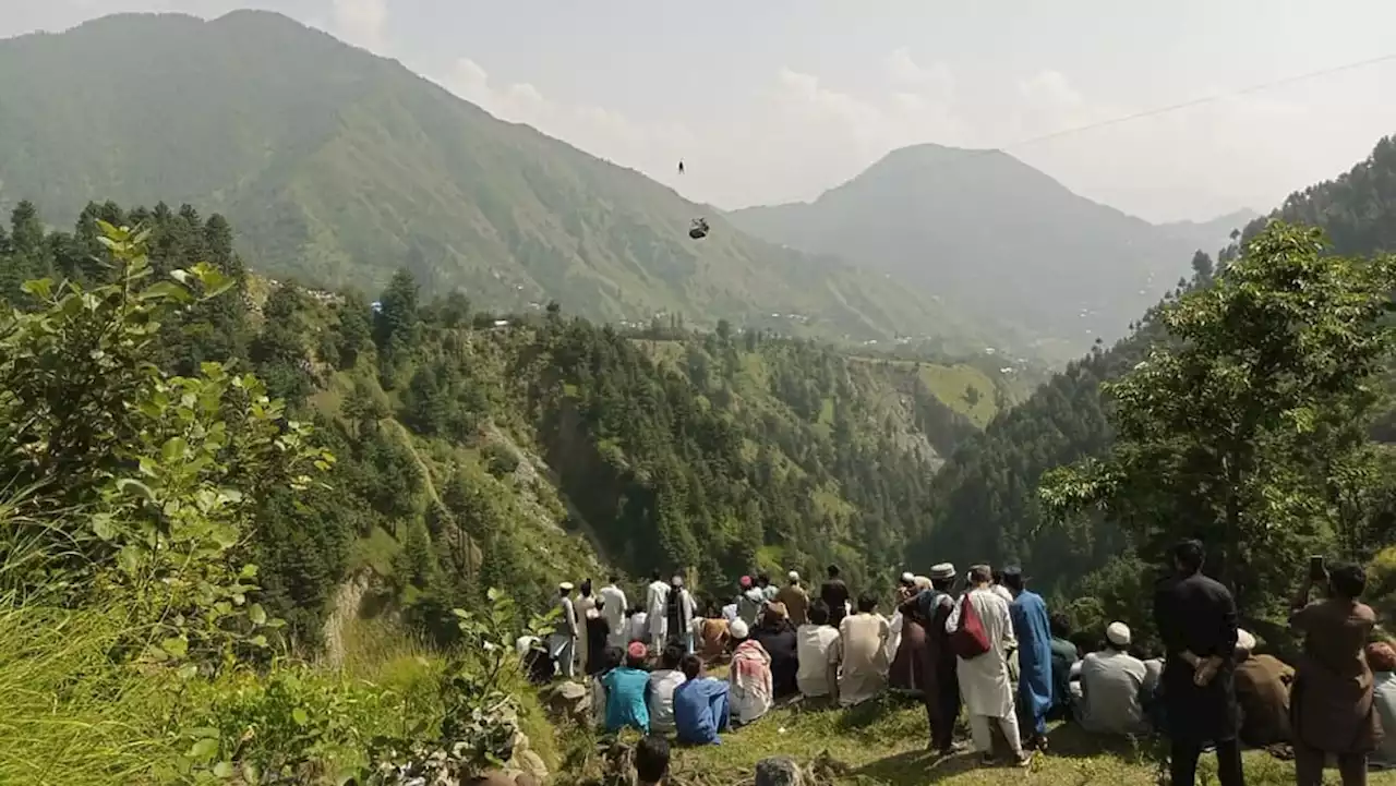 8 people, including children, trapped in cable car dangling over Pakistan ravine